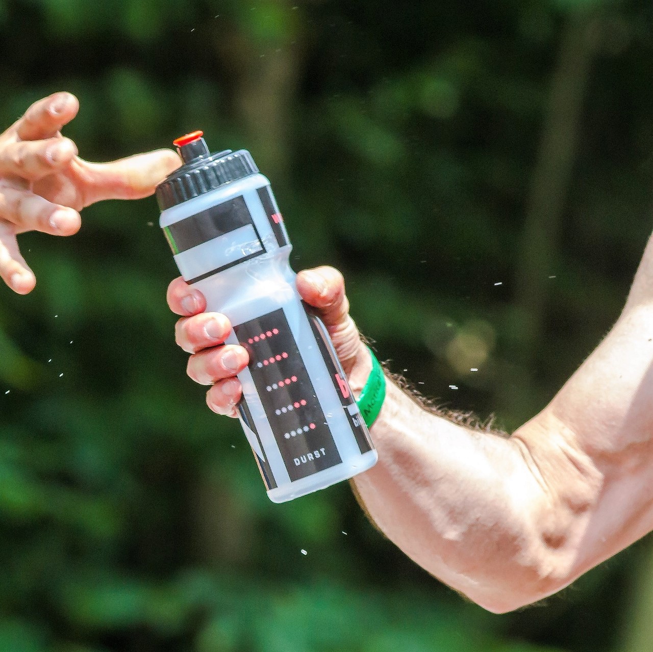 A man with a water bottle dehydrated