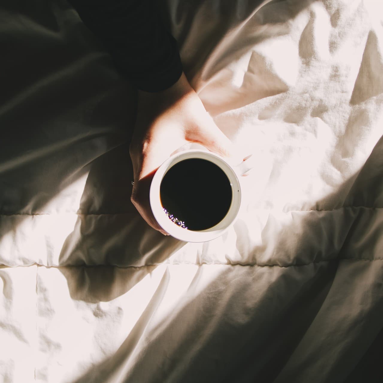 Coffe on a sleeping bed