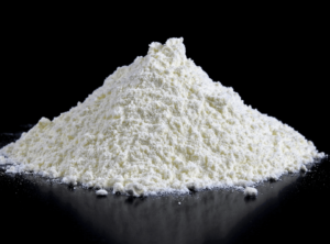 A stack of white protein powder