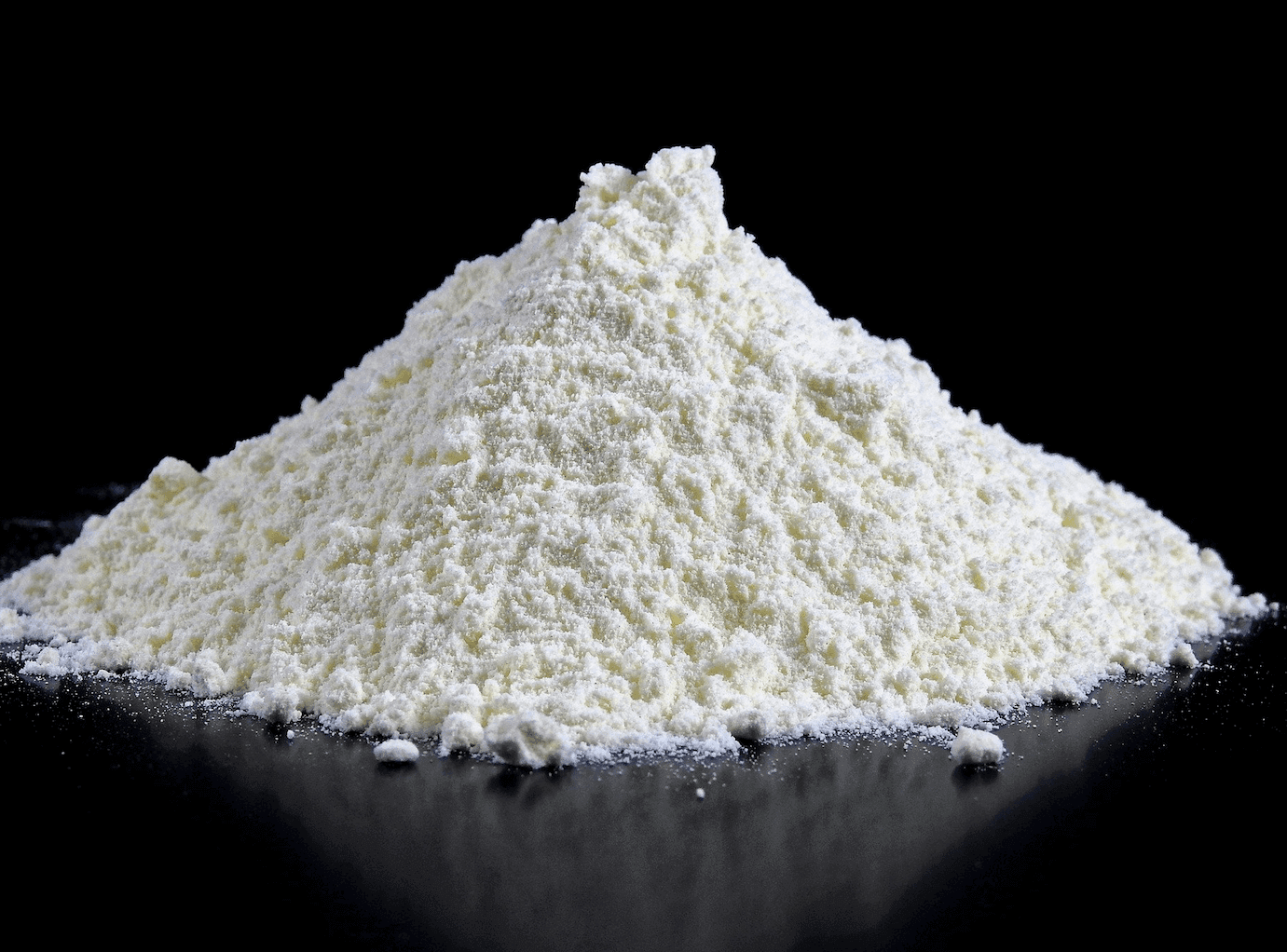 A stack of white protein powder