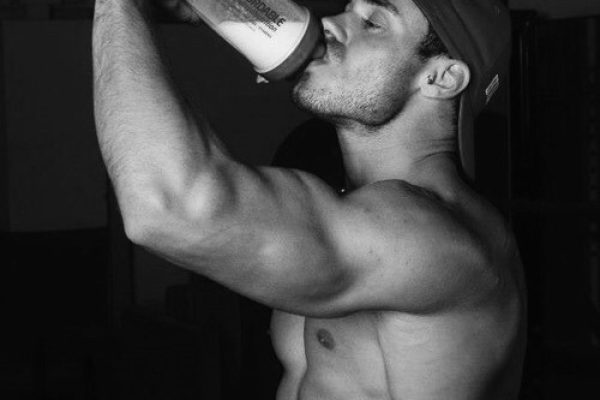 A man drinking protein